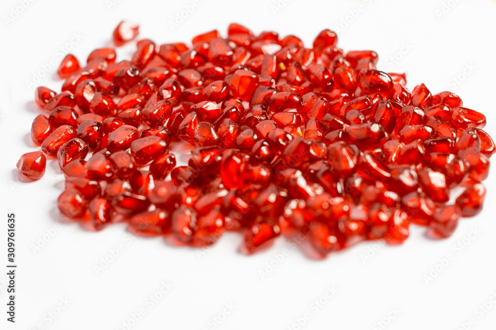 Grain pomegranate on a white background, beautiful texture. Grain pomegranate on a white background, beautiful texture.