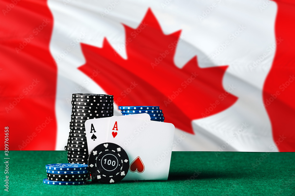 Canada casino theme. Two ace in poker game, cards and black chips on green table with national flag background. Gambling and betting.