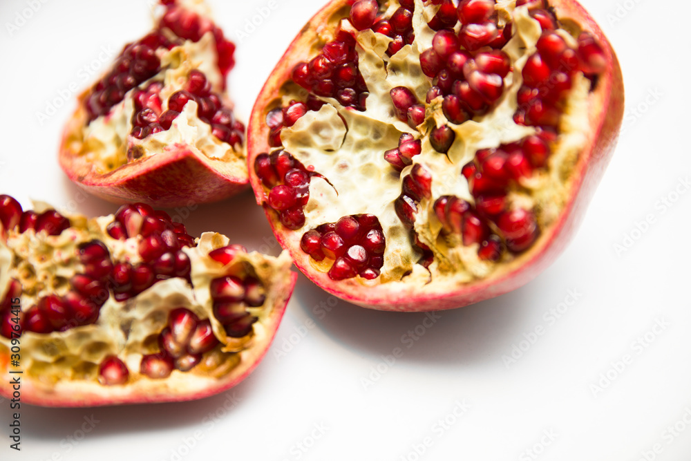 Sliced pommegranate on the white background Sliced pommegranate on the white background