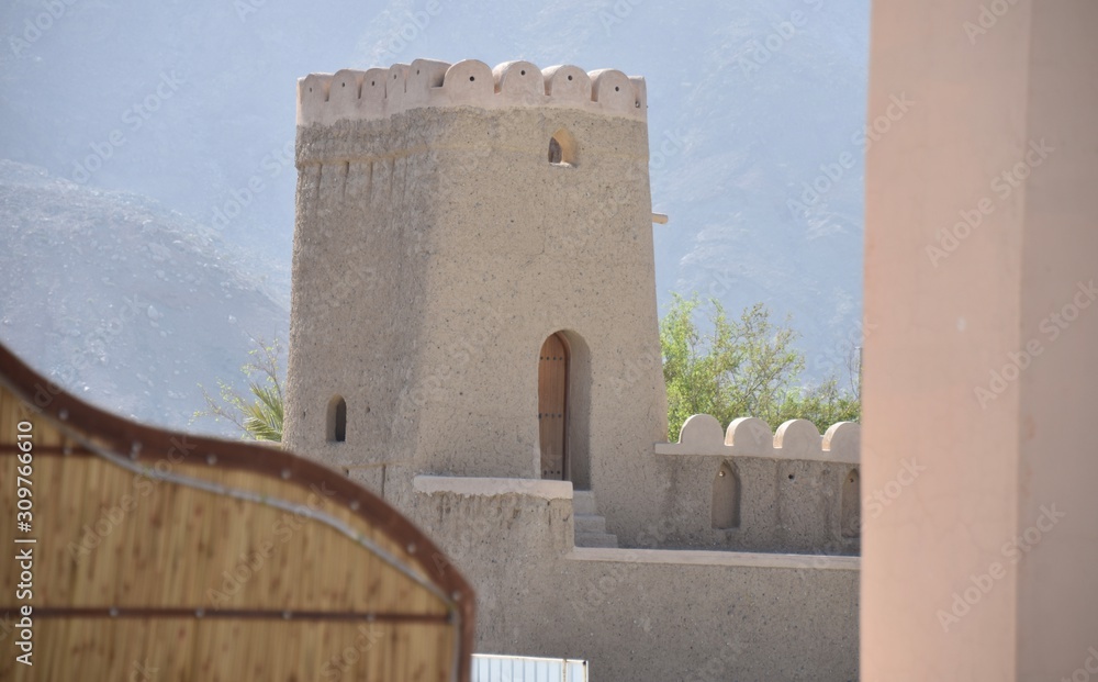 Castle Corner Tower with Foreground Framing Elements, Nizwa, Oman Castle Corner Tower with Foreground Framing Elements, Nizwa, Oman