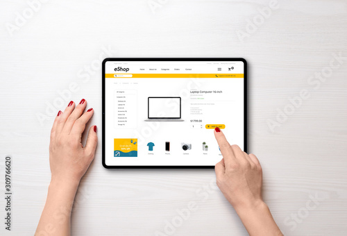 Shopping online with tablet. Modern online shop with grab deals banner on desk. Top view, falt lay