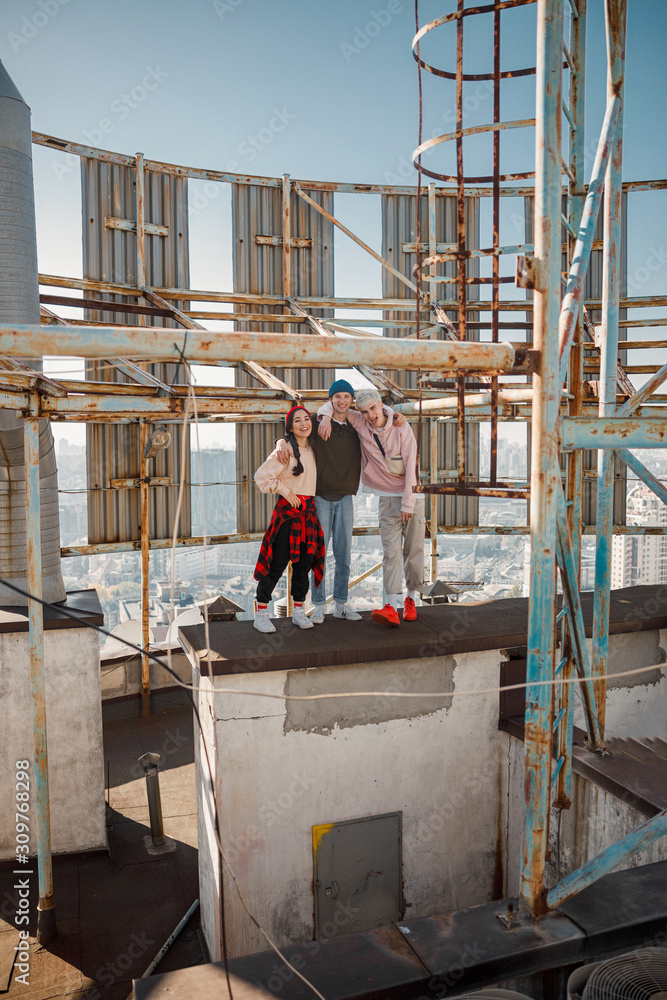 Friends are so happy to spend time together on rooftop Friends are so happy to spend time together on rooftop
