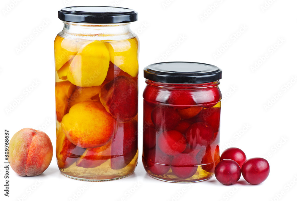 Peach slices and cherry plums canned in glass jar isolated on white background Peach slices and cherry plums canned in glass jar isolated on white background