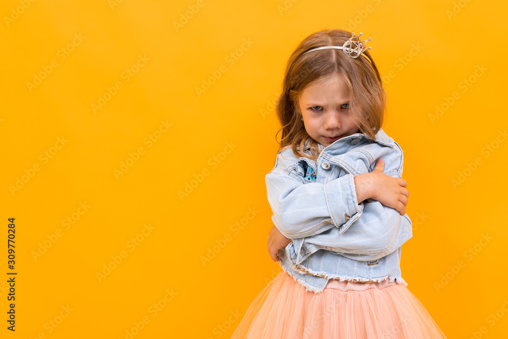 Pretty caucasian girl gesticulates isolated on yellow background