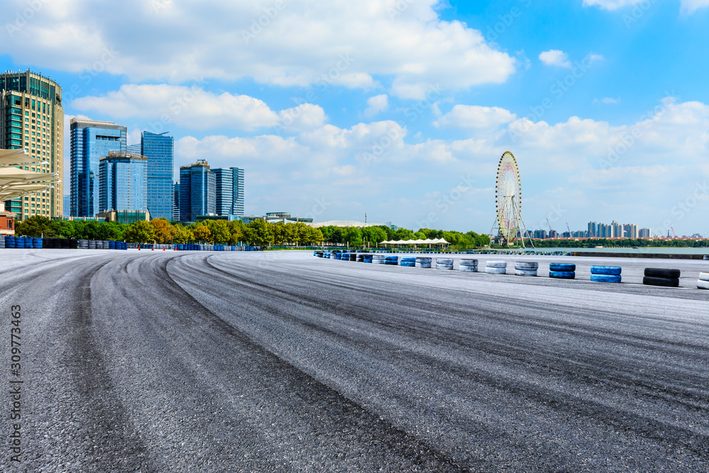 Race track ground and Suzhou city skyline on a sunny day. Race track ground and Suzhou city skyline on a sunny day.
