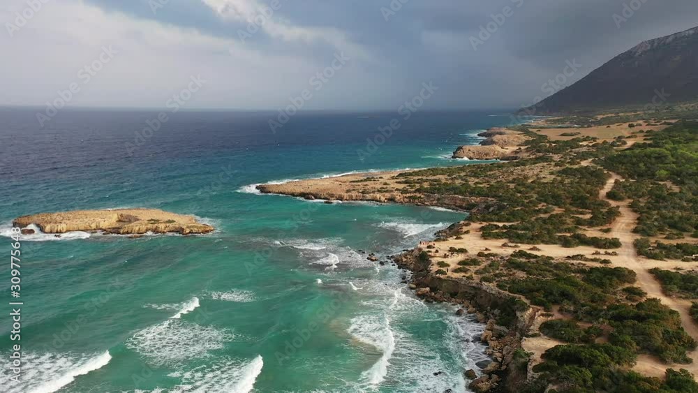 Flight over the Blue Lagoon. Beautiful bay and small island. Cyprus, the Mediterranean Sea Flight over the Blue Lagoon. Beautiful bay and small island. Cyprus, the Mediterranean Sea