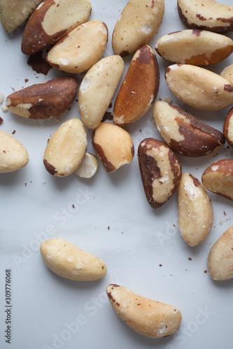 Brazil nuts on white marble background