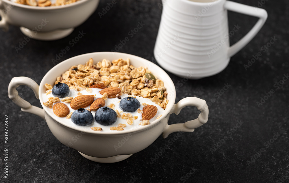 Granola, oatmeal with almond and berry food background Granola, oatmeal with almond and berry food background