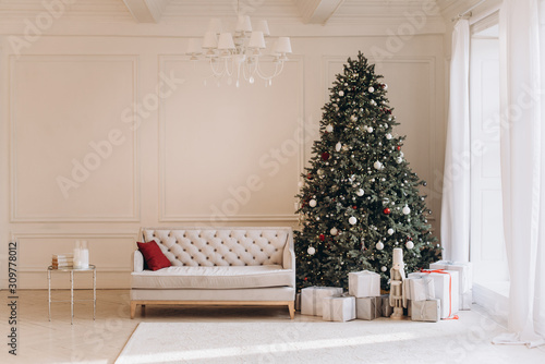 Christmas living room interior with vintage sofa and Christmas tree.