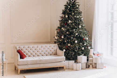Christmas living room interior with vintage sofa and Christmas tree.