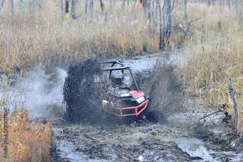 Amazing UTV driving in mud and water at Autumn day. ATV/UTV/4x4 off-road