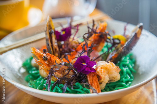 Green noodles with tiger prawn
