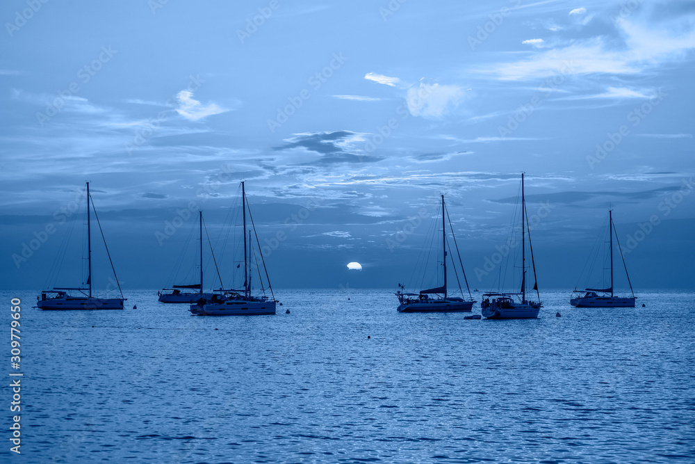 Fototapeta premium Evening view on Yachts, fishing boats and the Adriatic sunset sea, Rovinj, Croatia.