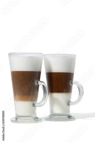 Two classes of caffe with milk on white background