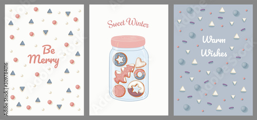 Postcards with sweet topping, hearts, snow, gingerbread cookies in a glass jar.