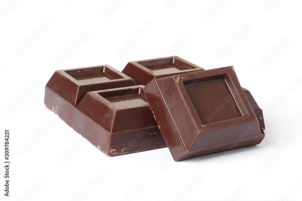 Dark chocolate pieces on white background Dark chocolate pieces on white background