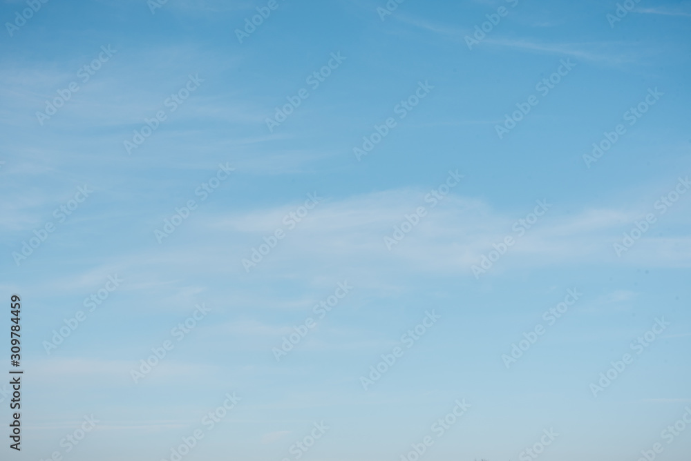 Background sky. Blue sky with clouds overhead. Sky close up