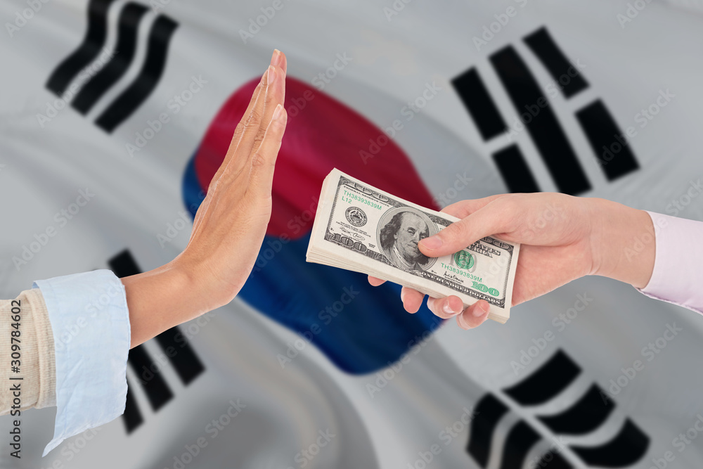 South Korea Bribery Refusing Closeup Of Female Hands Extending A Pile Of Dollar Bills To The Male Hands Gesturing As If Rejecting The Money Stock Photo Adobe Stock
