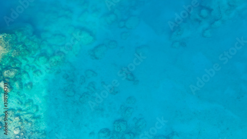 Aerial landscape seascape of coral reef and turquoise sea water, top view. Sea surface. Ecology concept, sea nature