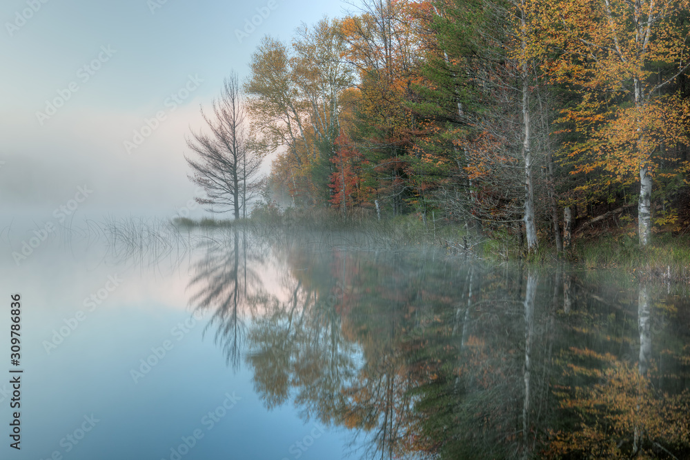 Autumn landscape at dawn of Council Lake in fog, Hiawatha National Forest, Michigan's Upper Peninsula, USA