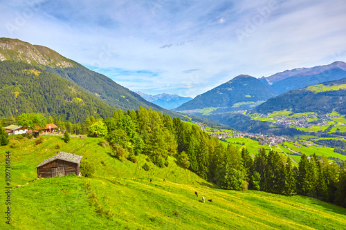 Beautiful mountain panorama in the Stubai Valley, with grazing cows.