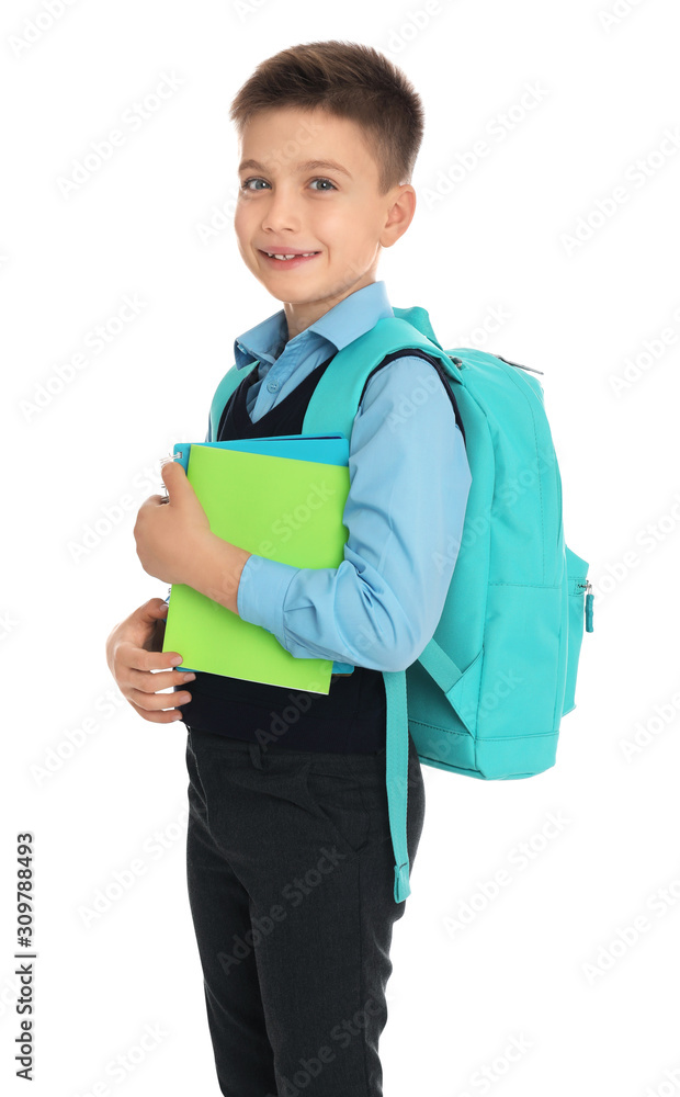 Little boy in uniform with school stationery on white background Little boy in uniform with school stationery on white background