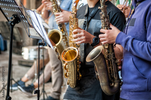 buskers. Saxophone, musical instrument played by saxophonist musicians.
