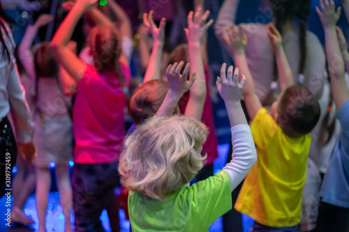 Children with hands up on holiday