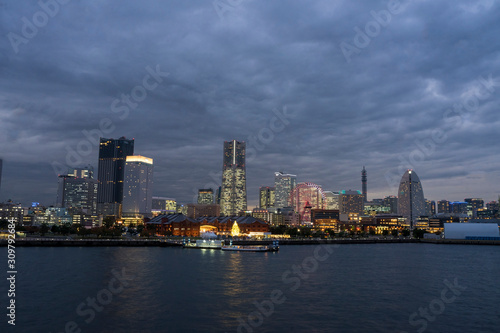 Cityscape of Yokohama MinatoMirai in Yokohama City Japan city skyline from the bay at twilight.