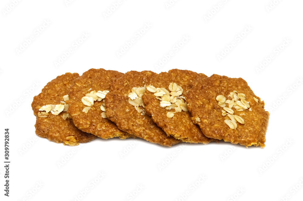 Biscuits homemade Oatmeal flavoured and Thin style. Stack of crunchy delicious sweet meal and useful cookies. Isolated on white background.