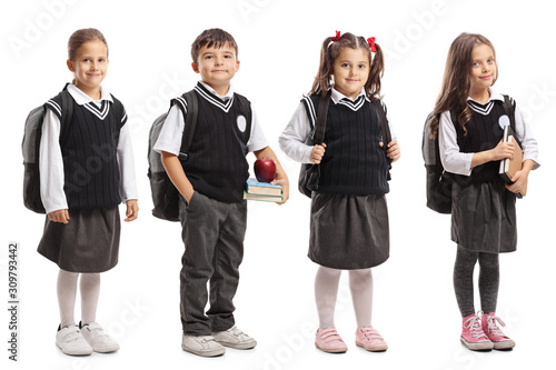 Photo Group of pupils with backpacks wearing a school uniform