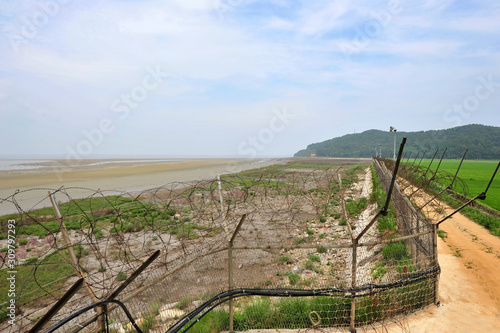 Barbed wire fence installed along the shore