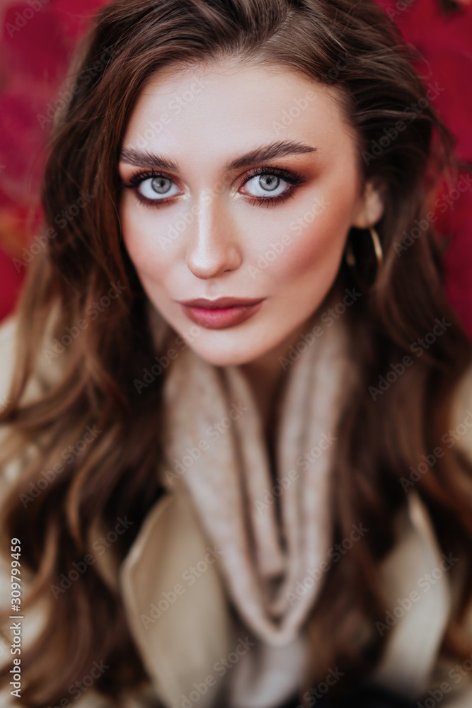 Fashion woman on a background of red and yellow autumn leaves Fashion woman on a background of red and yellow autumn leaves