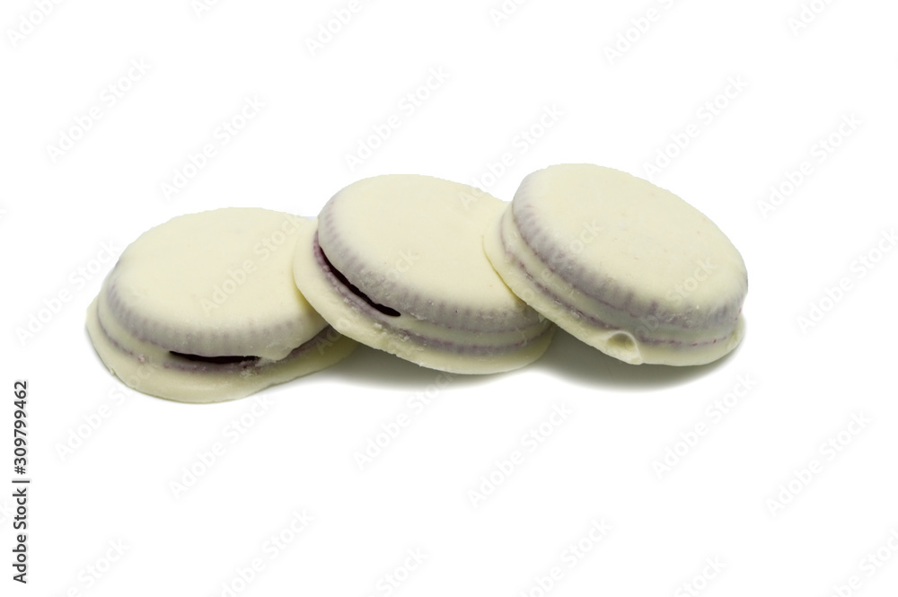 Chocolate sandwich cookies filled with cream cheese Red velvet and white chocolate flavoured coated isolated on white background. Chocolate sandwich cookies filled with cream cheese Red velvet and white chocolate flavoured coated isolated on white background.