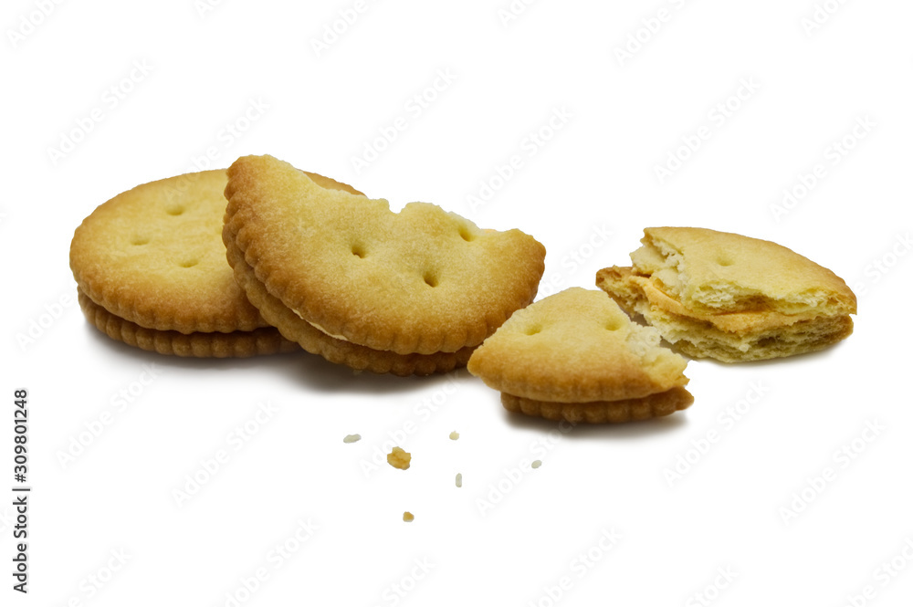 Biscuit broken with crumbs. Sandwich cracker Cheese flavoured ,Cream and butter. Crunchy delicious sweet meal and useful cookies. Isolated on white background. Biscuit broken with crumbs. Sandwich cracker Cheese flavoured ,Cream and butter. Crunchy delicious sweet meal and useful cookies. Isolated on white background.
