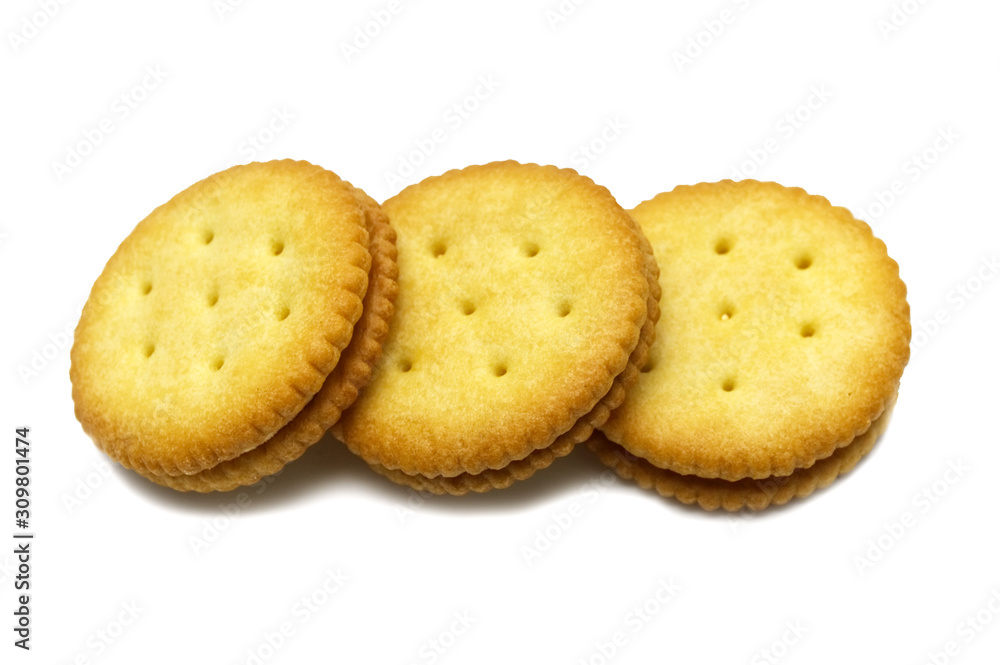 Biscuit sandwich cracker Cheese flavoured ,Cream and butter. Stack of crunchy delicious sweet meal and useful cookies. Isolated on white background. Biscuit sandwich cracker Cheese flavoured ,Cream and butter. Stack of crunchy delicious sweet meal and useful cookies. Isolated on white background.