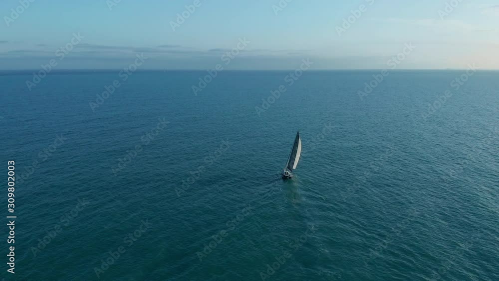 Aerial view. Yacht sailing on opened sea. Sailing boat. Yachting video footage. Yacht from above. Sailboat view from drone. Aerial view. Yacht sailing on opened sea. Sailing boat. Yachting video footage. Yacht from above. Sailboat view from drone.