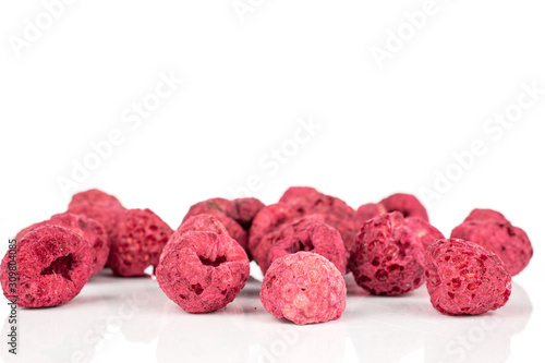 Lot of whole dried raspberry isolated on white background
