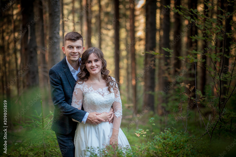 Bride and groom in forest on their wedding, photo session. Bride and groom in forest on their wedding, photo session.