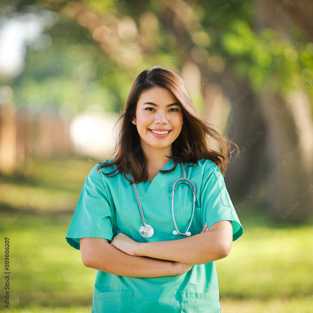 Asian woman in doctor uniform portrait smile and happy face Asian woman in doctor uniform portrait smile and happy face