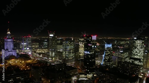Wallpaper Mural Aerial view of skyscrapers and buildings in Warsaw City skyline,  night light in the winter. Poland.  04. December. 2019. View of the night skyscrapers and streets in the business center of the city.  Torontodigital.ca