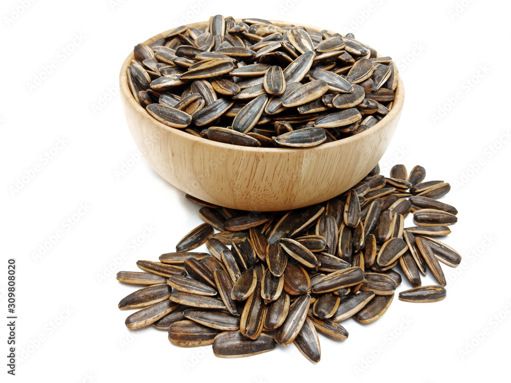 Sunflower seeds in bowl isolated on white background.Roasted, Salted in the original flavor.Great nutritous and rich with oil which makes it a high energy source.Snack for diet and healthy. Sunflower seeds in bowl isolated on white background.Roasted, Salted in the original flavor.Great nutritous and rich with oil which makes it a high energy source.Snack for diet and healthy.