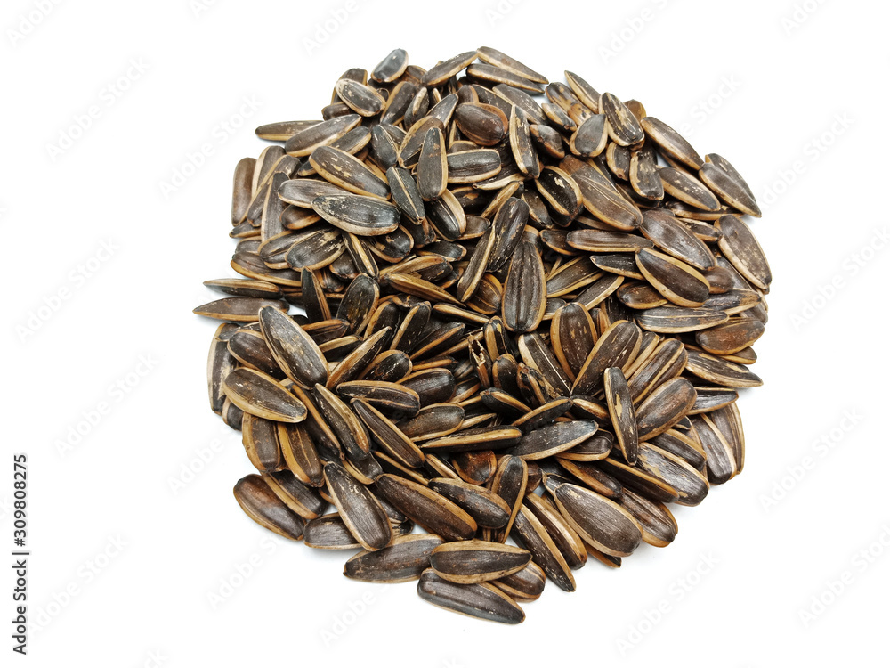 Sunflower seeds pile against isolated on white background. Roasted and Salted in the original flavor. Great nutritous and rich with oil which makes it a high energy source. Snack for diet and healthy. Sunflower seeds pile against isolated on white background. Roasted and Salted in the original flavor. Great nutritous and rich with oil which makes it a high energy source. Snack for diet and healthy.