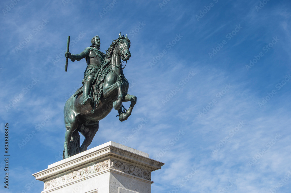 bronze equestrian sculpture of Felipe IV cropped on background sky