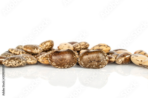 Lot of whole speckled brown bean pinto isolated on white background