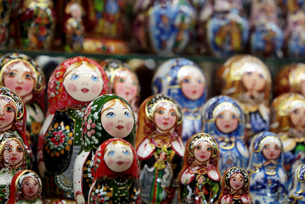 Fototapeta premium Russian nesting dolls in the souvenir shop. Traditional wooden matryoshka dolls