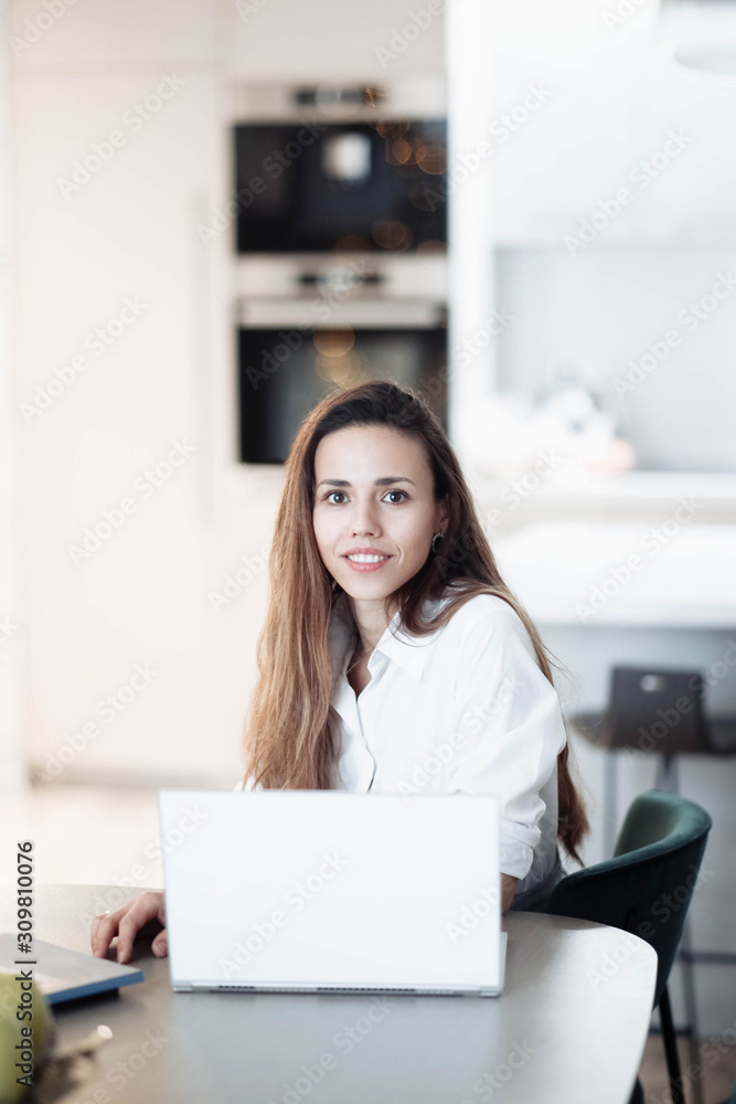 Woman business worker in modern bright coworking office working with laptop, interior designer. Woman business worker in modern bright coworking office working with laptop, interior designer.