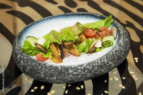 Salad with fried potato let...