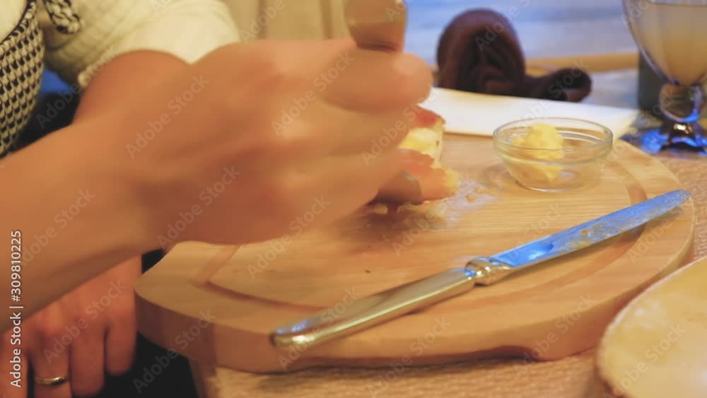 Junk food a woman sitting at a table in a restaurant eating a pie Junk food a woman sitting at a table in a restaurant eating a pie
