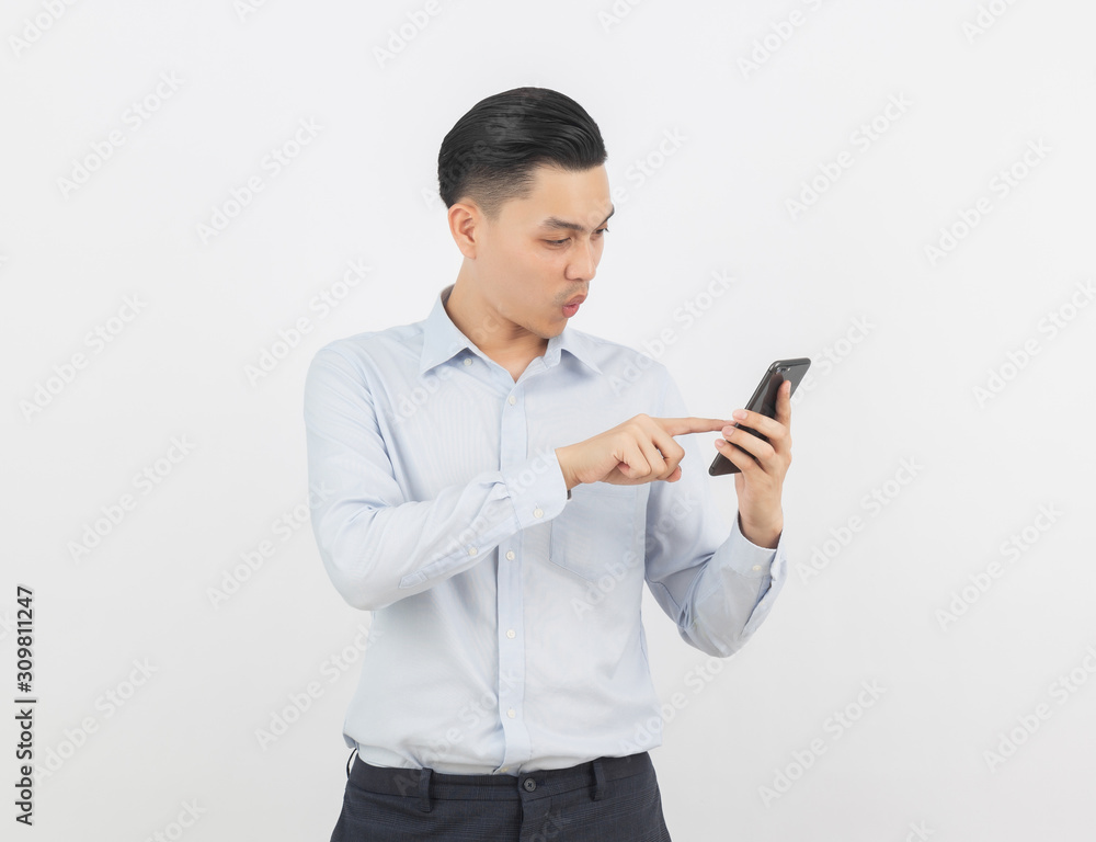 Young handsome asian business man playing smartphone with smiling isolated on white background. Young handsome asian business man playing smartphone with smiling isolated on white background.